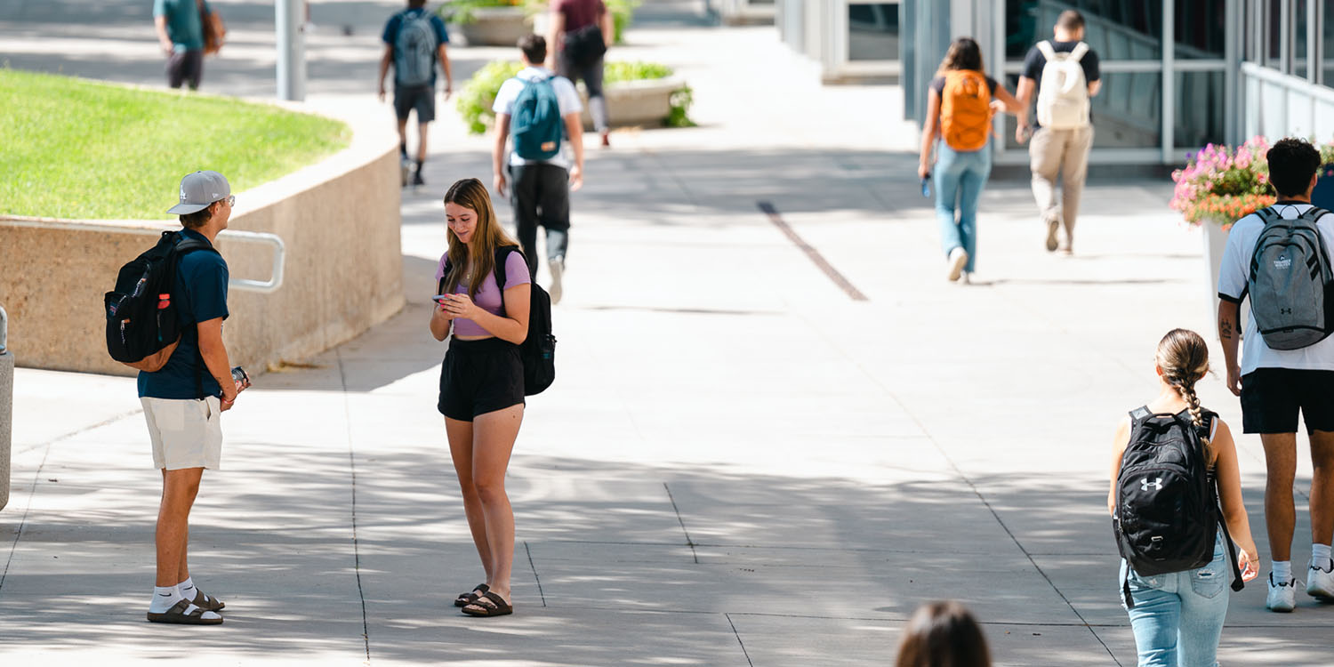 students walking through campus the first day of class