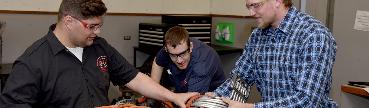 AIM students working on motor piece