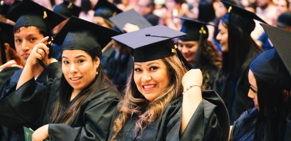 Students in caps and gowns.
