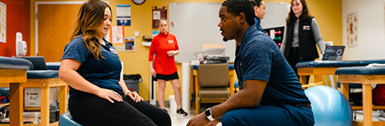 Student with breathing apparatus on a treadmill