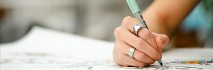 Student writing in class. 