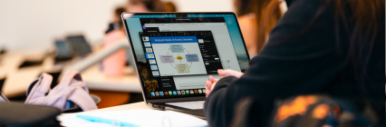 Laptop pulled up in classroom. 