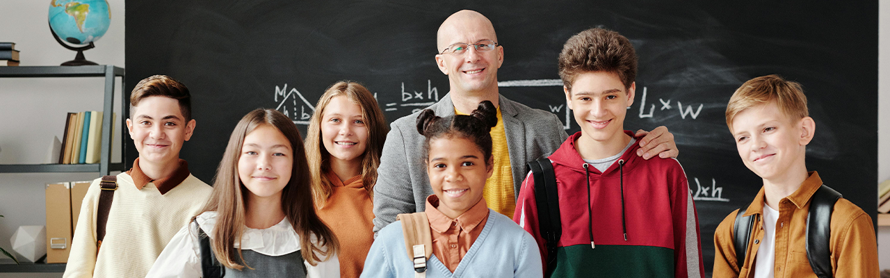 teacher and students smiling