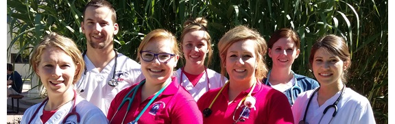 Seven nursing students smiling at camera