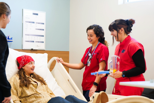 nurse educator smiling on stairs