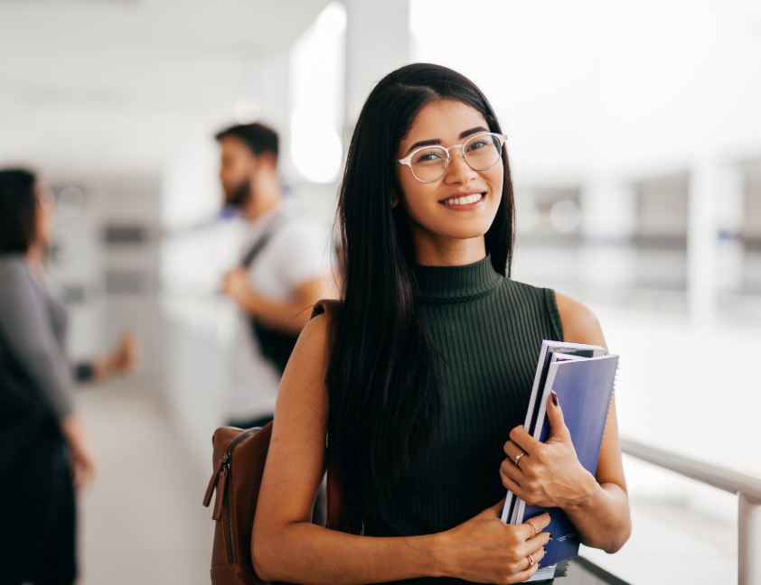 student holding books